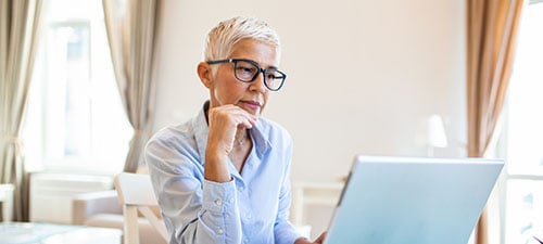 AMWA Member Working at Laptop showcasing AMWA Products and Services